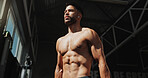 Fitness, gym and bodybuilder man with music and thinking of training, muscle growth and self care. Earphones, workout playlist and person or health club membership for exercise, strong and wellness