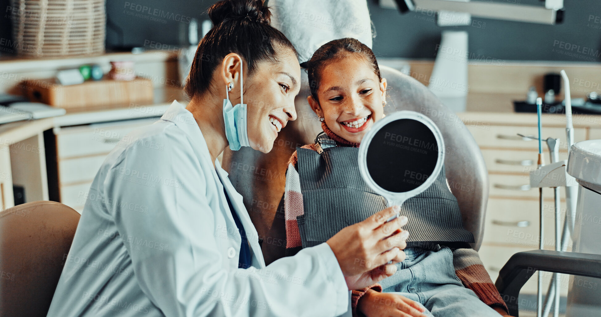 Buy stock photo Dentist, mirror and smile of child in medical clinic for results of mouth care or teeth whitening. Dental, satisfaction and woman with girl in dentistry office for oral hygiene or procedure success