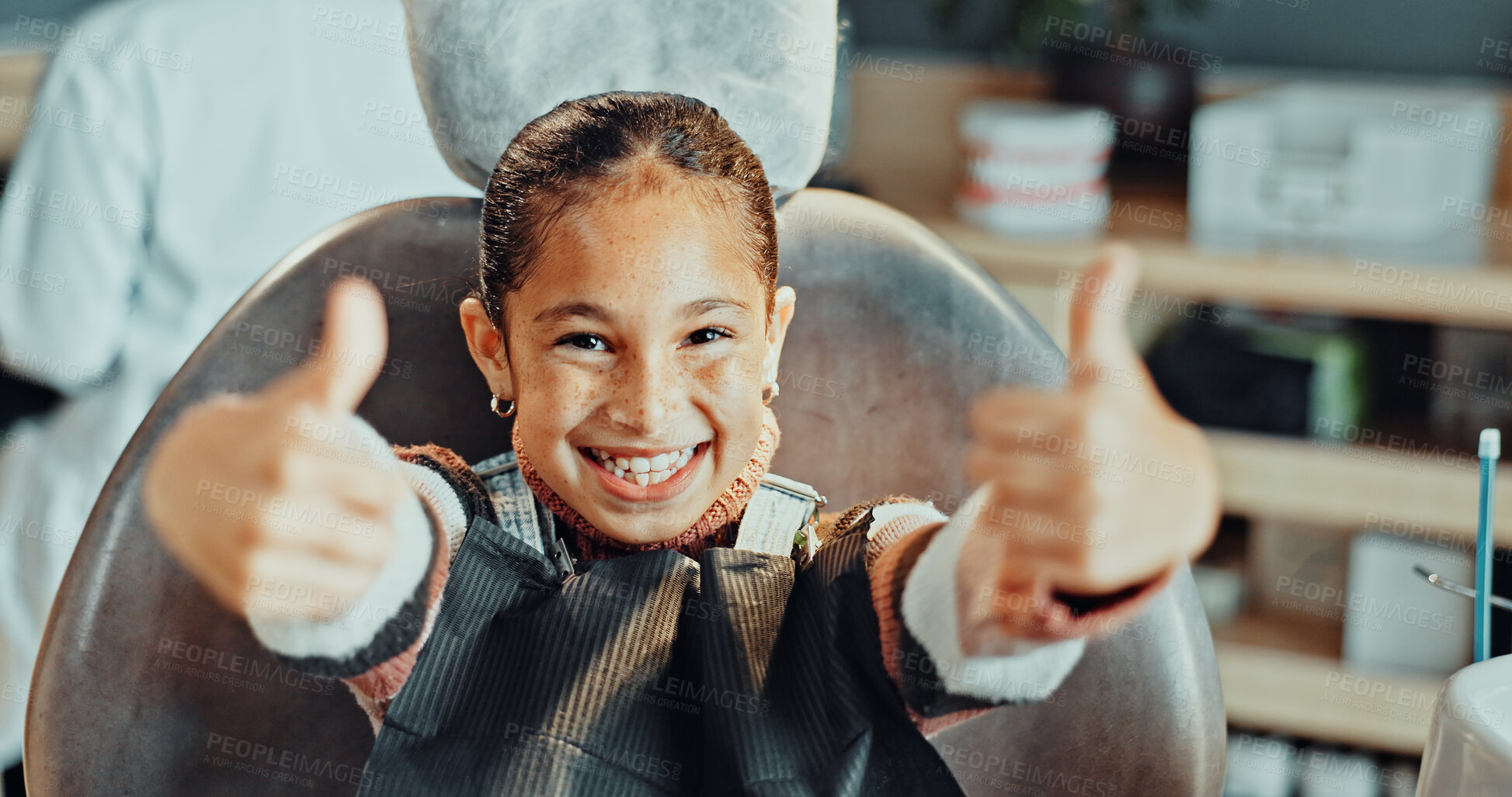 Buy stock photo Portrait, girl or dentist with thumbs up in clinic for dental hygiene, treatment or success. Child, kid or patient with big smile, like emoji or yes sign for dentistry satisfaction or oral healthcare