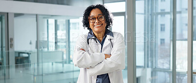Buy stock photo Portrait, mature and doctor at hospital with smile, career pride and about us for medical opinion. Happy, woman and crossed arms in workplace with ambition, positive attitude and healthcare services