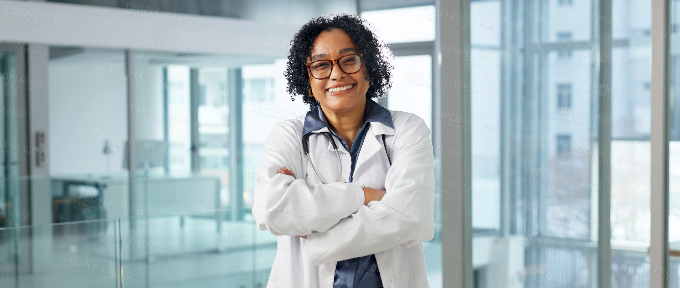 Buy stock photo Portrait, mature and doctor at hospital with smile, career pride and about us for medical opinion. Happy, woman and crossed arms in workplace with ambition, positive attitude and healthcare services