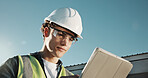 Engineer, man and tablet at site with PPE, online checklist and quality assurance for construction. Low angle, engineering supervisor and person outdoor with safety gear, tech or building inspection.