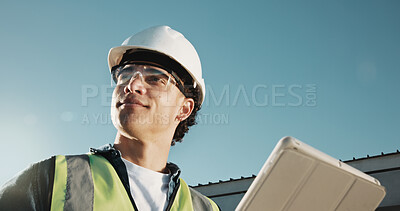 Buy stock photo Engineer, man and thinking at construction site with tablet, PPE and planning for renovation project. Low angle, engineering supervisor or person outdoor with safety gear, tech or building inspection