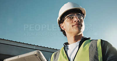Buy stock photo Engineer, man and tablet at construction site with PPE, vision and thinking for renovation project. Low angle, engineering supervisor and person outdoor with safety gear, tech or building inspection.