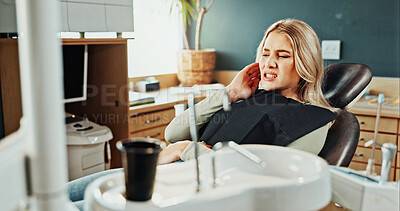 Buy stock photo Woman, toothache or gum disease in dentist for cavity, oral infection or tooth extraction in clinic. Female person, patient or sore jaw with teeth ache or pain for root canal or dental treatment