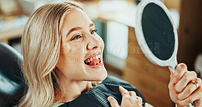 Buy stock photo Woman, happy and inspection with mirror for oral hygiene, results and teeth whitening at dental clinic. Smile, patient and healthcare at orthodontist for tooth cleaning, veneers and dentist implants
