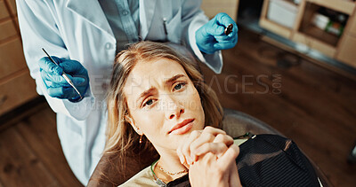 Buy stock photo Scared, patient and woman with dentist in office, dental hygiene and anxious for medical procedure. Clinic, portrait and person with stress for teeth exam, above and checkup for oral care and health