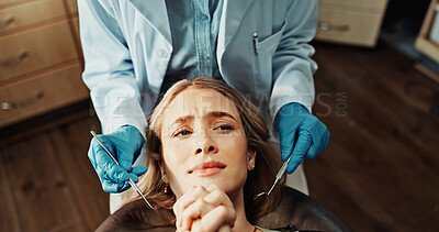 Buy stock photo Patient, worried and woman with dentist in office, dental health or frightened of medical procedure. Clinic, above and person with stress for teeth exam, scared and checkup for oral care and help
