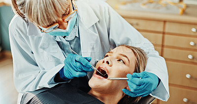 Buy stock photo Consultation, dentist and woman in clinic for exam, teeth cleaning or extraction for dental health. Medical checkup, oral hygiene and orthodontist with patient for root canal or whitening treatment.