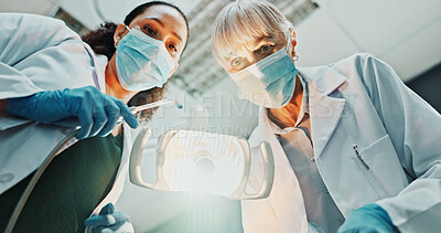 Buy stock photo Dentist, light and pov with procedure in hospital for oral care, service and medical consultation. Dentistry, mature woman and low angle with equipment for dental hygiene, appointment and teamwork