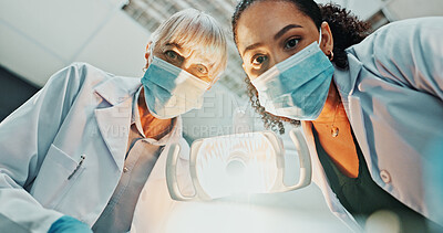Buy stock photo Dentist, light and pov with surgery in hospital for oral care, service and medical consultation. Dentistry, mature woman and low angle with equipment for dental hygiene, appointment and teamwork