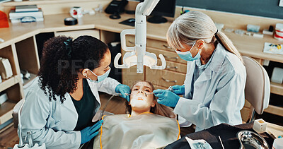 Buy stock photo Dentist, team and patient in office for procedure, dental suction or mirror for cleaning tooth decay. Orthodontics, women and help for oral hygiene, tools assistant and medical health with ppe