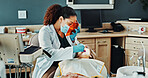 Clinic, patient and dentist with face mask for consulting, oral hygiene and medical service. Healthcare, woman and orthodontist with protection for dental care, cavity removal and teeth cleaning