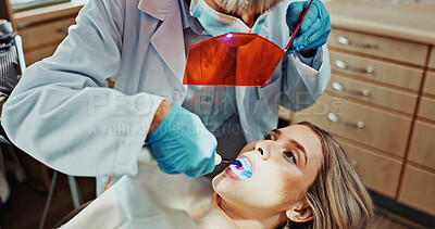 Buy stock photo Consulting, face mask and dentist with woman in clinic for teeth cleaning, oral health and medical service. Healthcare, patient and orthodontist with protection for dental care, hygiene and cavity
