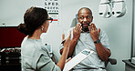 Optometry, clipboard and man in clinic consulting for sight, vision and results for eye exam. Healthcare, talking and optician with patient for checkup, medical report and ophthalmology appointment