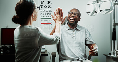 Buy stock photo Optometrist, patient and happy with high five for eye care, sight clarity or vision test success. Optometry, worker and mature man in clinic celebration for new glasses, ocular health or prescription
