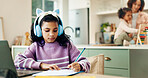 Child, laptop and writing with headphones for homework, elearning course or assessment in home. Girl, kid or student with computer or assignment for distance learning, education or growth in house