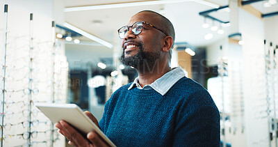 Buy stock photo Optometry, happy and man on tablet for store inventory, inspection and checklist for frames. Shop, mature and African person on digital tech with prescription lens, spectacles and glasses for vision