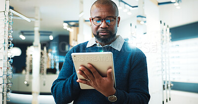 Buy stock photo Optometry, online and man on tablet for store inventory, stock and checklist for frames. Shop, mature and African person on digital tech with prescription lens, spectacles and glasses for vision