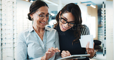 Buy stock photo Optometry, tablet and help with women in store for  consulting, glasses advice and discussion. Lens fitting, online prescription and eye care with client and optometrist in clinic for ophthalmology