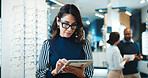 Glasses, woman or tablet in store for optometry, order custom lenses or website update. Optical assistant, eyewear or mature person with tech for stock check, online inventory or product info in shop