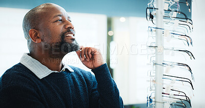 Buy stock photo Customer, optometry or black man thinking with glasses in store for frame option or choice. Male person, client or contemplating with smile or spectacles for vision, sight or shopping eyewear in shop