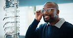 Customer, optometry or happy black man with glasses in store for frame option, selection or choice. Male person, client or decision with smile or spectacles for vision, sight or shopping eyewear