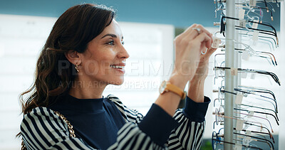 Buy stock photo Frame, smile and optometry with woman in store for prescription, eye care or spectacle option. Glasses, ophthalmology and lens choice with mature person for vision health and optical wellness