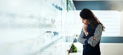 Buy stock photo Glasses, thinking and optometry with woman in store for prescription, eye care or spectacle option. Space, ophthalmology and lens choice with mature person in clinic for vision health and optical