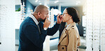 Man, optometrist and eye test with customer in store for examination or lens prescription. Male person, client or checking vision with spectacles or frame for eyesight, checkup or optometry in shop