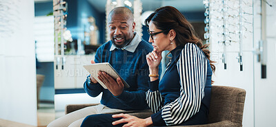 Buy stock photo Optician, woman and tablet in store for consulting, digital lookbook and advice on lens upgrade. Optometry, mature customer or shop assistant with tech for frame planning, vision care plan or pricing