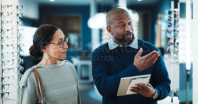 Buy stock photo Optometry, tablet and retail with people in store for  consulting, glasses advice or discussion. Lens fitting, online prescription and eye care with client and optometrist in clinic for ophthalmology
