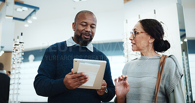 Buy stock photo Optometry, man or tablet in store for consulting, digital lookbook and advice on glasses upgrade. Eye care, mature customer or optical assistant with tech for frame planning, color options or pricing