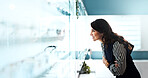 Glasses, happy and optometry with woman in store for prescription, eye care or spectacle option. Space, ophthalmology and lens choice with mature person in clinic for vision health and optical