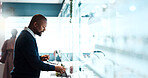 Glasses, choice and optometry with black man in store for prescription, eye care or spectacle option. Space, ophthalmology and lens shopping with mature person in clinic for vision health and optical