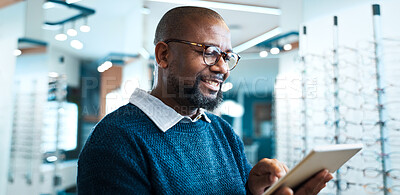 Buy stock photo Happy, man and tablet in shop for eye care, order custom lenses or process insurance claims. Optician, glasses and mature black person with smile for store operations, online inventory or telehealth