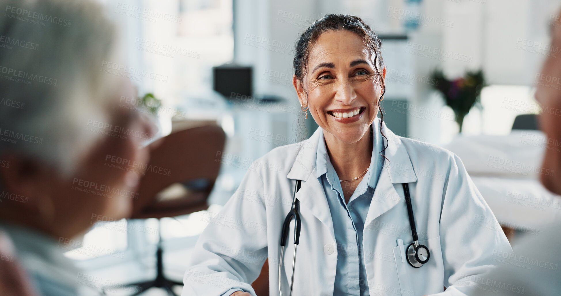 Buy stock photo Doctor, smile and old couple in office with consultation, assistance or positive feedback for health. Happy, healthcare worker and married senior people with good news, test results and wellness.