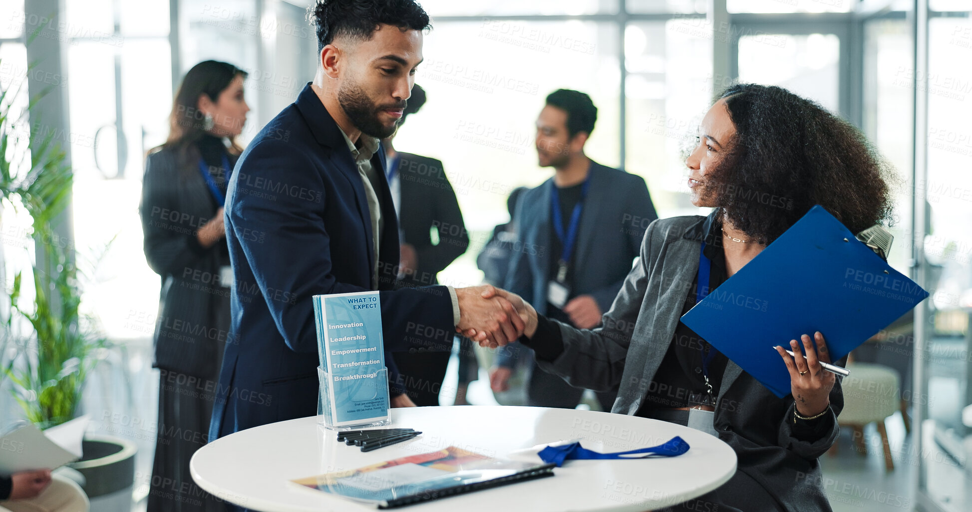 Buy stock photo Business people, conference and shaking hands for meeting, greeting guest and empowerment event. Transformation seminar, happy group or handshake for welcome, hello or networking with clipboard