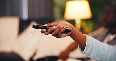 Buy stock photo Person, hands and watching tv with remote in home for online entertainment or subscription. User, relax and changing channel with controller signal on sofa for weekend connection or holiday in house
