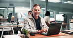 Happy, portrait and man with laptop in office, career development and financial analysis on website. Corporate, data analyst and mature person with tech, graphs and smile with research in Canada