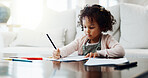 Education, drawing and paper with girl child in living room of home for creative expression. Artistic, learning and writing with cute kid in apartment for development, future or growth on weekend