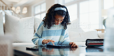 Buy stock photo Education, student and tablet with girl in living room of home for online course or lesson. App, homework and learning with child in apartment for digital streaming or virtual class on weekend