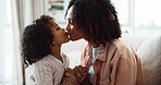 Mother, love and kiss child in house with trust, care and connection for bonding together on weekend. Happy, woman and daughter in living room with affection, support and nurture for family wellness.