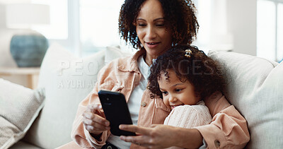 Buy stock photo Child, smile and mom with phone in lounge, online and watching video with app subscription in house. Family, love and happy woman with mobile, entertainment and bonding with daughter on break in home
