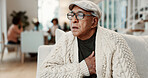 Senior, man and home with chest pain on sofa for heart attack, hypertension or asthma. Elderly, male person or sore ache with chronic illness or bronchitis for cardiac arrest or high blood pressure
