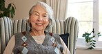 Relax, smile and senior woman in home for retirement, contentment or optimism with portrait. Happy, elderly person and resting on chair for wellness, peace and calm at living room in Switzerland