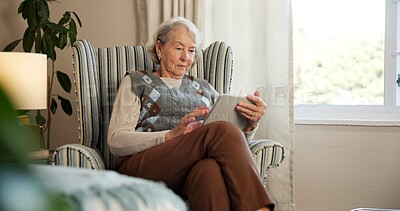 Buy stock photo Tablet, reading and senior woman on chair for online news, ebook or internet browsing. Retirement, old person or relax with digital tech in home for streaming subscription, puzzle or social media