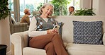 Cellphone, typing and senior woman in retirement home with texting, email or reading blog on app. Technology, relax and elderly person with phone for chatting on website in living room at house.