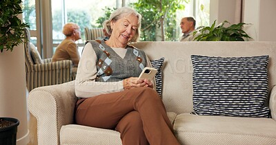Buy stock photo Cellphone, typing and senior woman in retirement home with texting, email or reading blog on app. Technology, relax and elderly person with phone for chatting on website in living room at house.