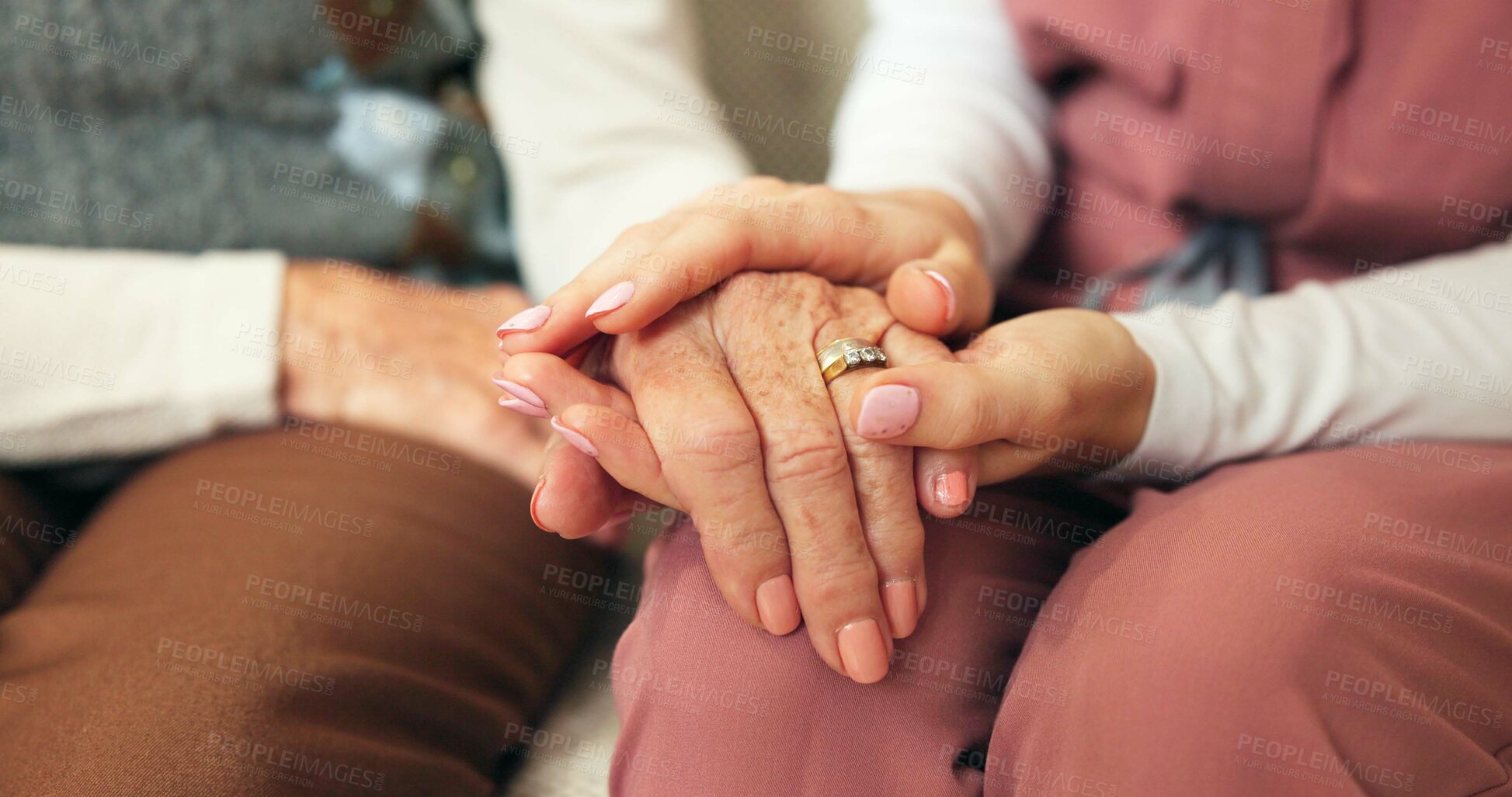 Buy stock photo People, nurse or hands together for elderly care, trust or understanding with empathy in old age home. Caregiver, volunteer or healthcare with support for assisted living, comfort or wellness on sofa